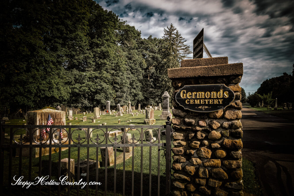 Entry sign on a stone pillar at Germonds Cemetery in Clarkstown, NY.