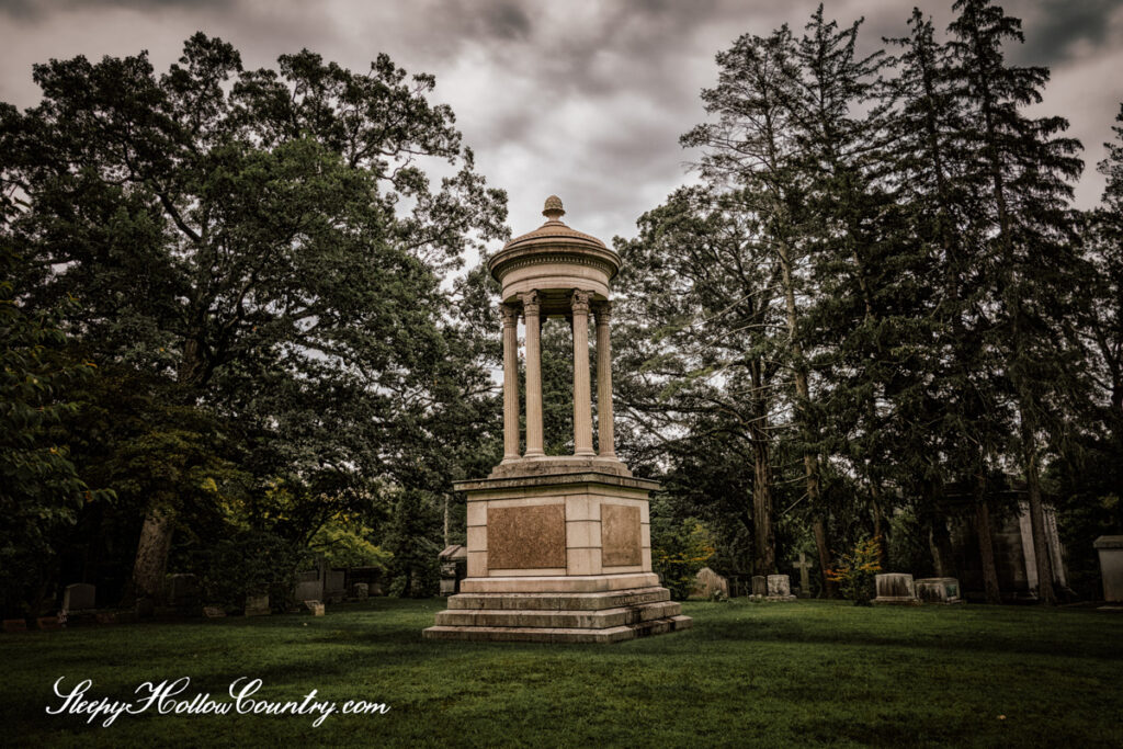 The monument of James Jennings McComb and his second wife, Mary Esther Wood McComb, stands at one of the highest points in Sleepy Hollow Cemetery.