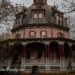 Armor-Stiner Octagon House in Irvington, NY is framed by eerie trees and a gloomy sky.
