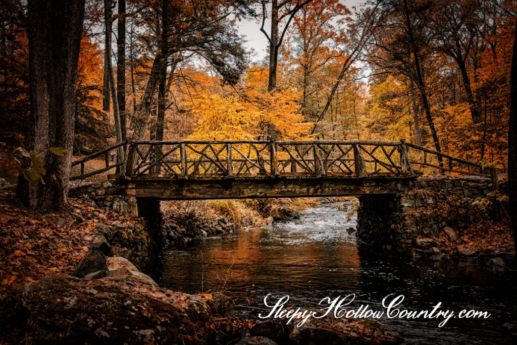 The Headless Horseman bridge in Sleepy Hollow Cemetery is framed by autumn colors.