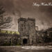 Main entrance to Tarrytown Castle, framed against a gloomy winter sky.